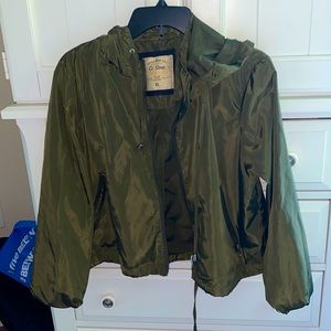Cropped army green rain jacket.